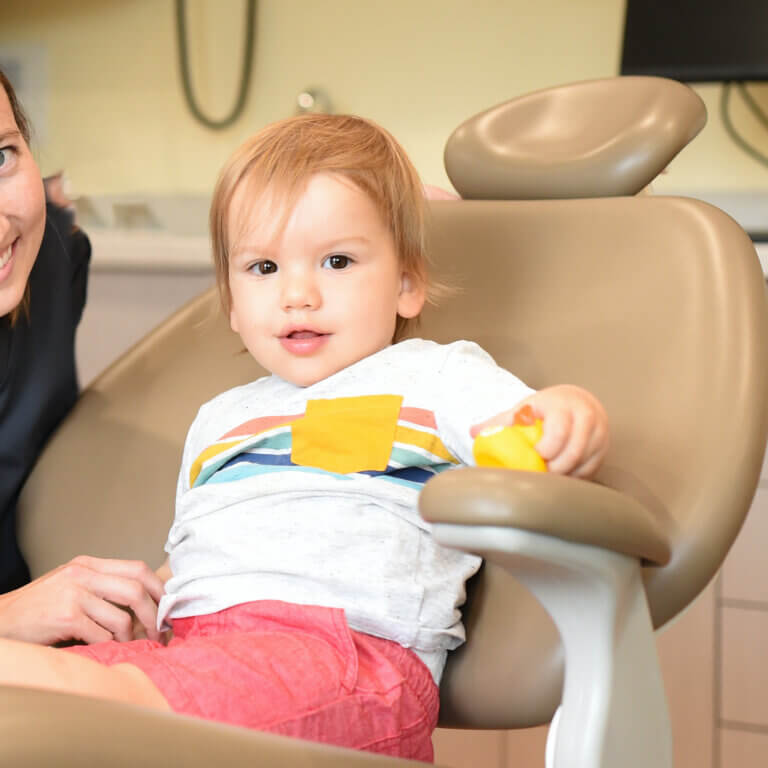 Infant in a dentist chair